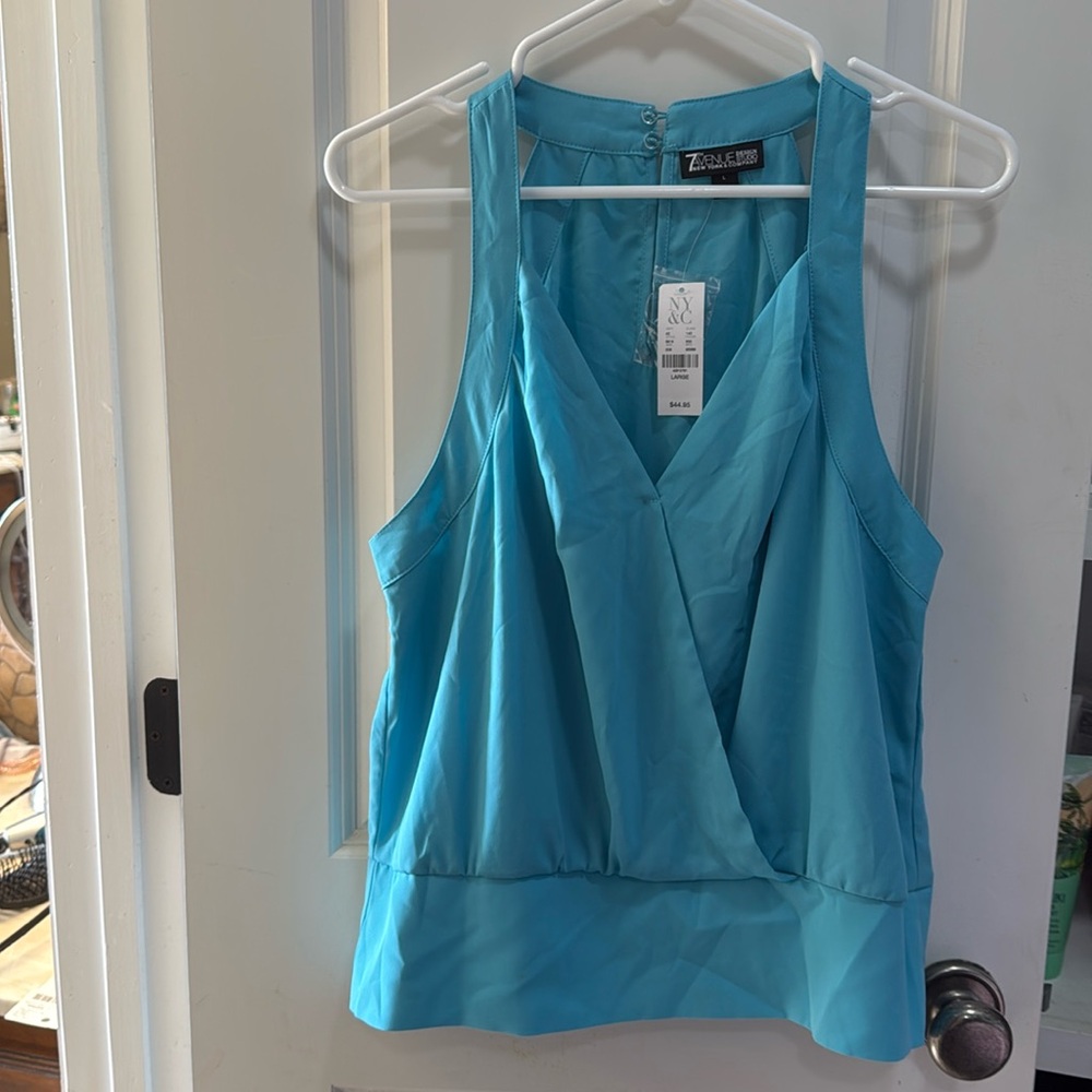 Never worn cute aqua/turquoise shirt